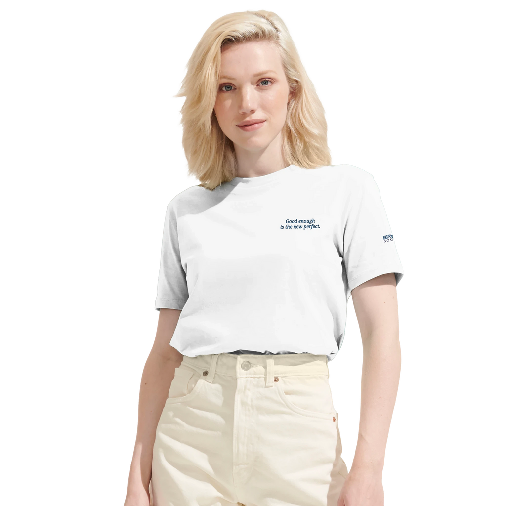 Blunt Spoon Society white organic cotton Reality Tee with small chest text and sleeve logo on a blonde model